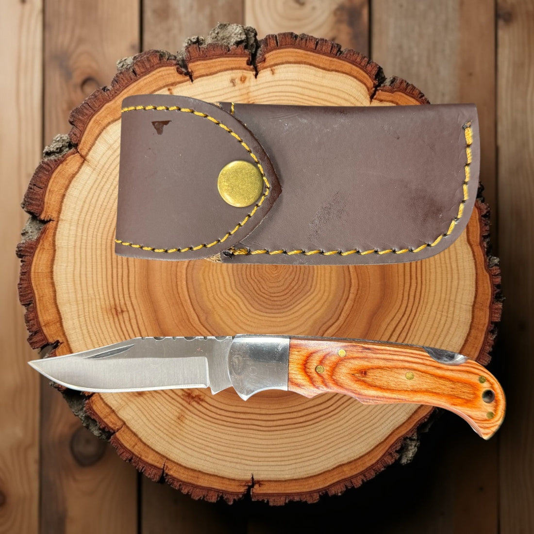 12C27 Stainless Steel Folding Pocket Knife — Pakkawood Handle + Leather Sheath |