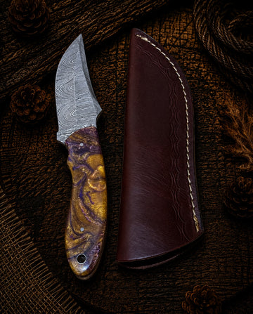 Compact fixed blade hunting knife with spalted natural wood handle and dark brown leather sheath
