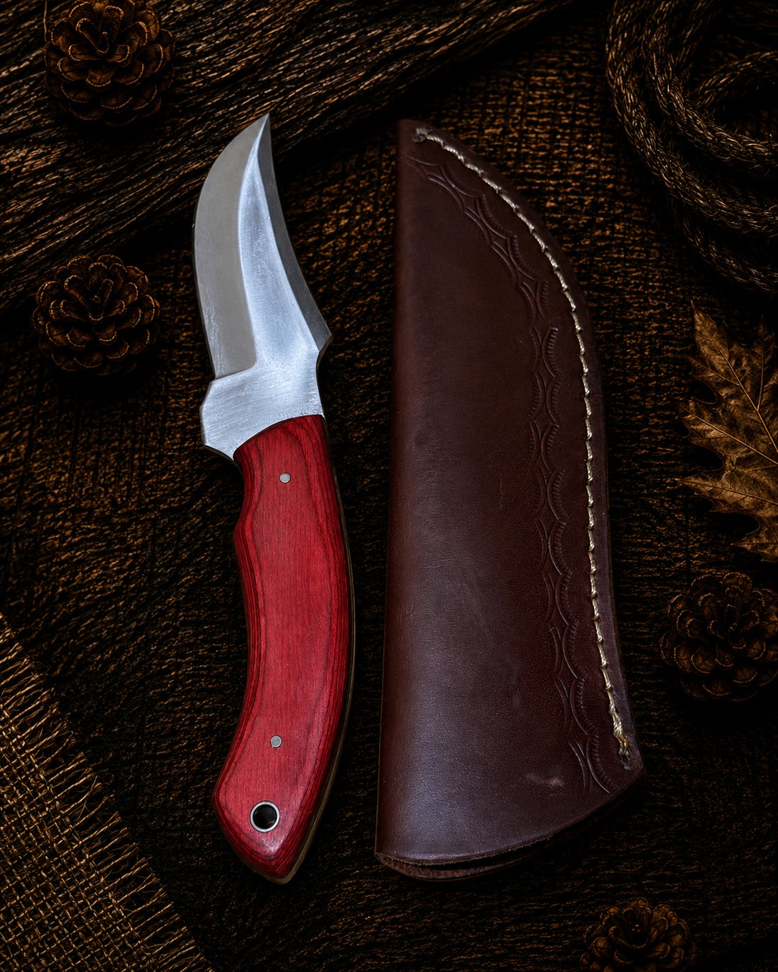 Fixed blade cleaver knife with blue and black pakkawood handle and embossed leather sheath