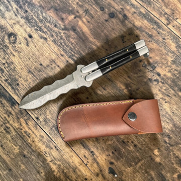 That's a nice Damascus steel balisong (butterfly knife) with: